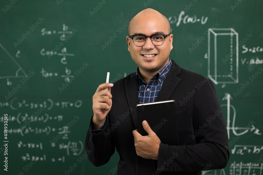 Young asian teacher man teaching video conference with student. Male Indian teacher training the mathematics in classroom from online course.