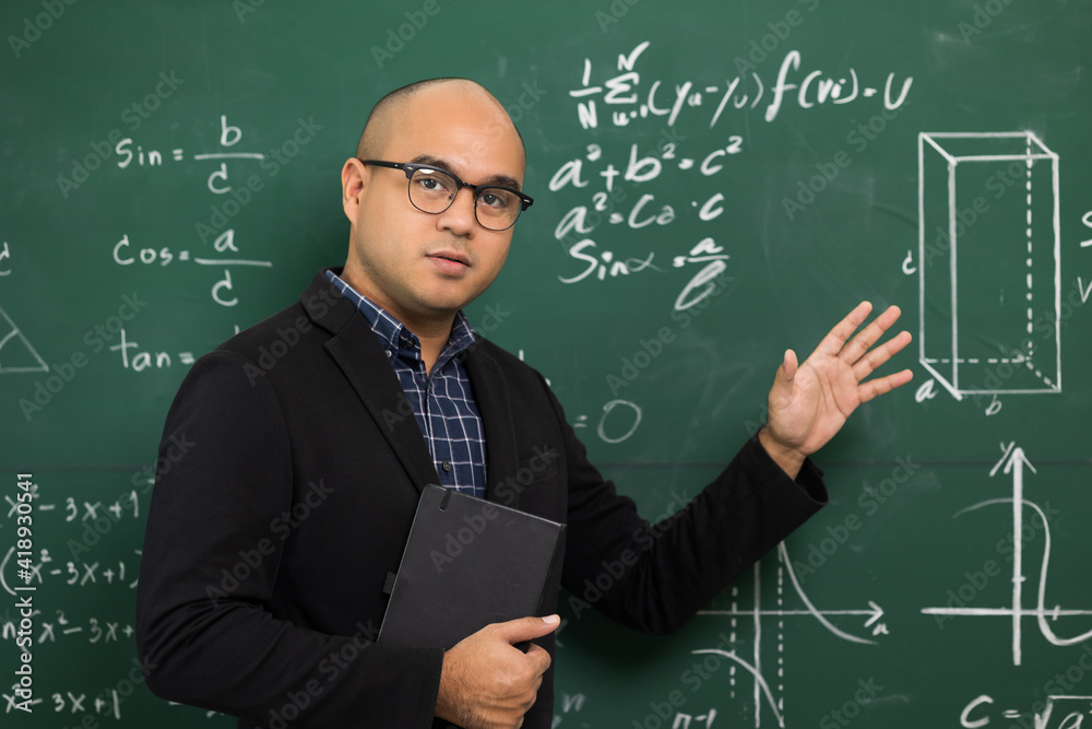 Young asian teacher man teaching video conference with student. Male Indian teacher training the mathematics in classroom from online course.