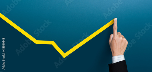 Businessman plan the growth and development, Economic recovery, businessman hand drawn a yellow line up