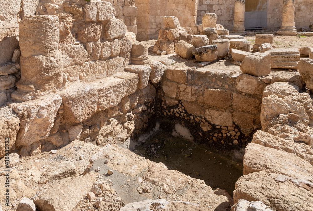 Ritual  Jewish bath for bathing - mikveh - in the courtyard of the ruins of the palace of King Herod - Herodion in the Judean Desert, in Israel