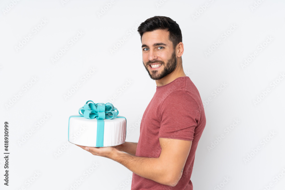 Pastry chef with a big cake isolated on white background Pastry chef with a big cake isolated on white background