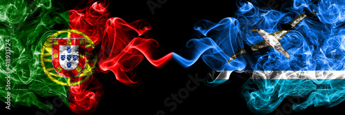 Portugal, Portuguese vs United States of America, America, US, USA, American, Midway Islands smoky mystic flags placed side by side. Thick colored silky abstract smoke flags. photo