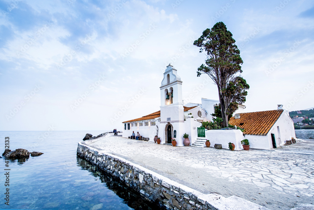 Beautiful charming optimistic view of Vlacherna Monastery on the Kanoni peninsula in Kerkyra, Corfu, Greece. popular tourist attractions. amazing places.