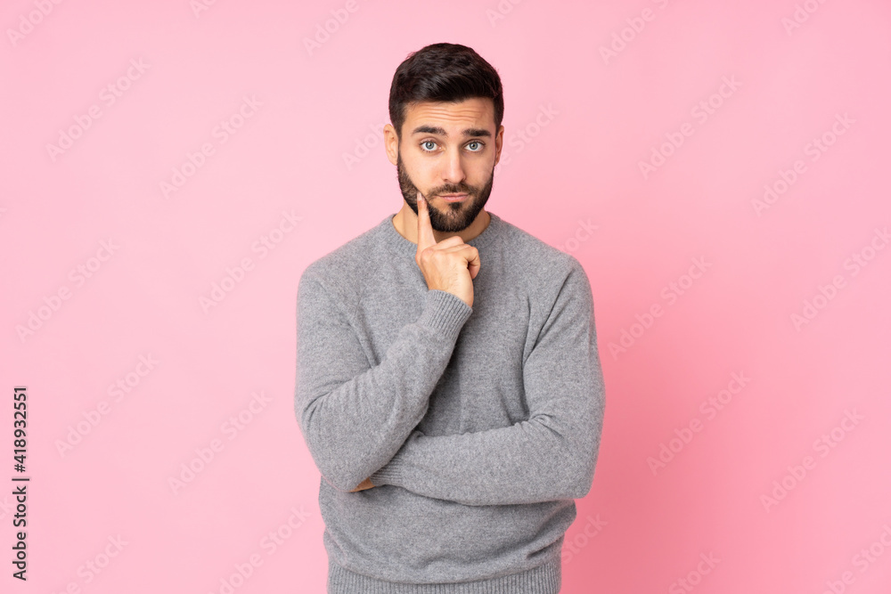 Caucasian handsome man over isolated background and thinking Caucasian handsome man over isolated background and thinking