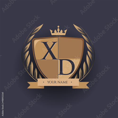 initial letter XD logotype colored brown and gold isolated with shield, crown and laurel design, logo for college and sport club. photo