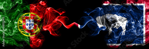 Portugal, Portuguese vs United States of America, America, US, USA, American, Wyoming smoky mystic flags placed side by side. Thick colored silky abstract smoke flags.