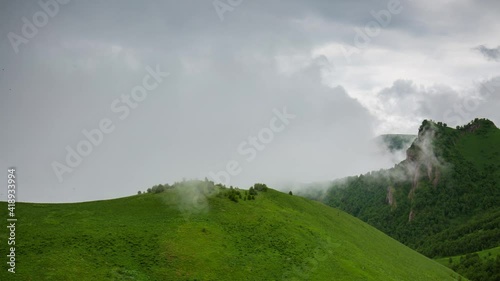 The formation and movement of clouds over the summer slopes of Adygea Bolshoy Thach and the Caucasus Mountains