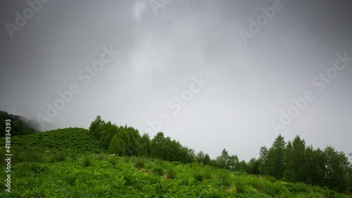 The formation and movement of clouds over the summer slopes of Adygea Bolshoy Thach and the Caucasus Mountains