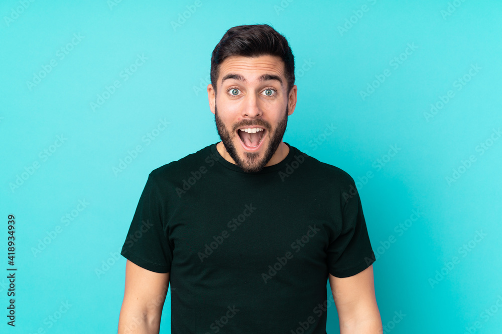 Caucasian handsome man isolated on blue background with surprise facial expression Caucasian handsome man isolated on blue background with surprise facial expression