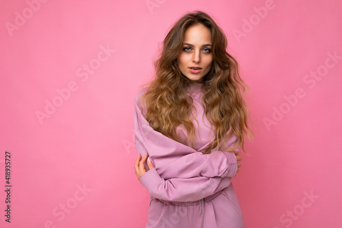 Close-up portrait of nice-looking attractive lovely lovable pretty cute winsome gorgeous cheerful cheery wavy-haired blonde woman isolated on pastel color background wearing stylish clothes