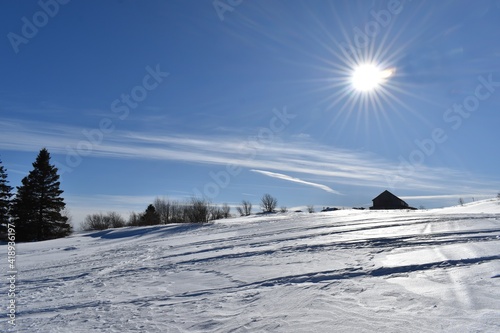 A snowmobile trail under a blue sky, Sainte-Apolline, Québec