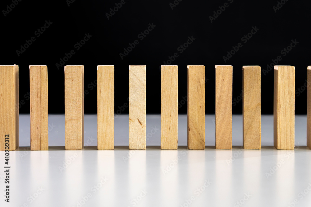 Business concept for growth success.Domino effect.
wooden blocks as dominos Business concept for growth success.Domino effect.
wooden blocks as dominos