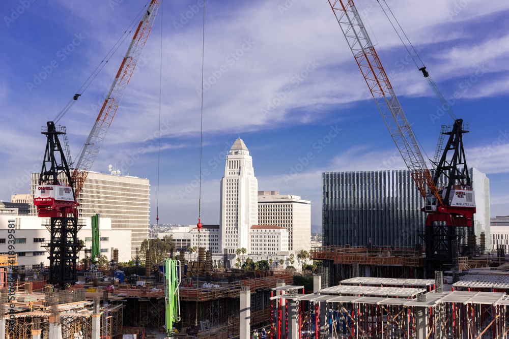 Los Angeles City Hall seen through new construction at Grand and First on bright sunny day