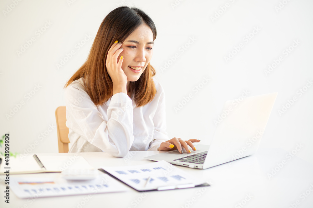 Working from home thailand Coronavirus lockdown self isolation. young Woman in her thirties working from home with a laptop,
Working from home thailand Coronavirus lockdown self isolation. young Woman in her thirties working from home with a laptop,