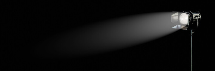 Movie light in the dark, studio spotlight, film production background banner with copy space