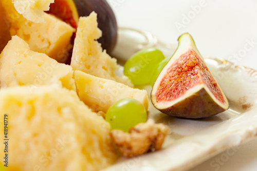 cheese plate, nuts, honey, figs