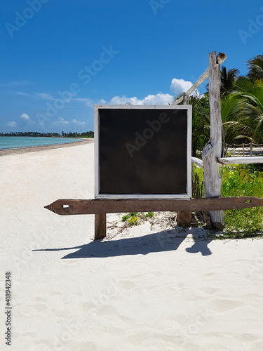 stand or board for notices on the oken sun beach near the hotel, background, template for text photo