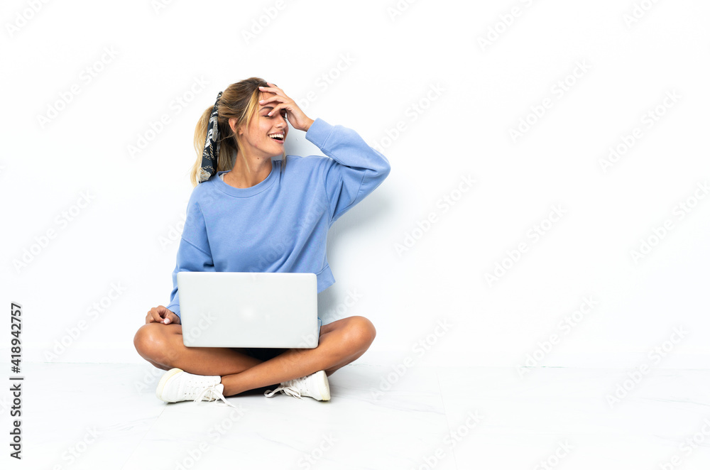 Young blonde Uruguayan girl with the laptop isolated on white background has realized something and intending the solution Young blonde Uruguayan girl with the laptop isolated on white background has realized something and intending the solution