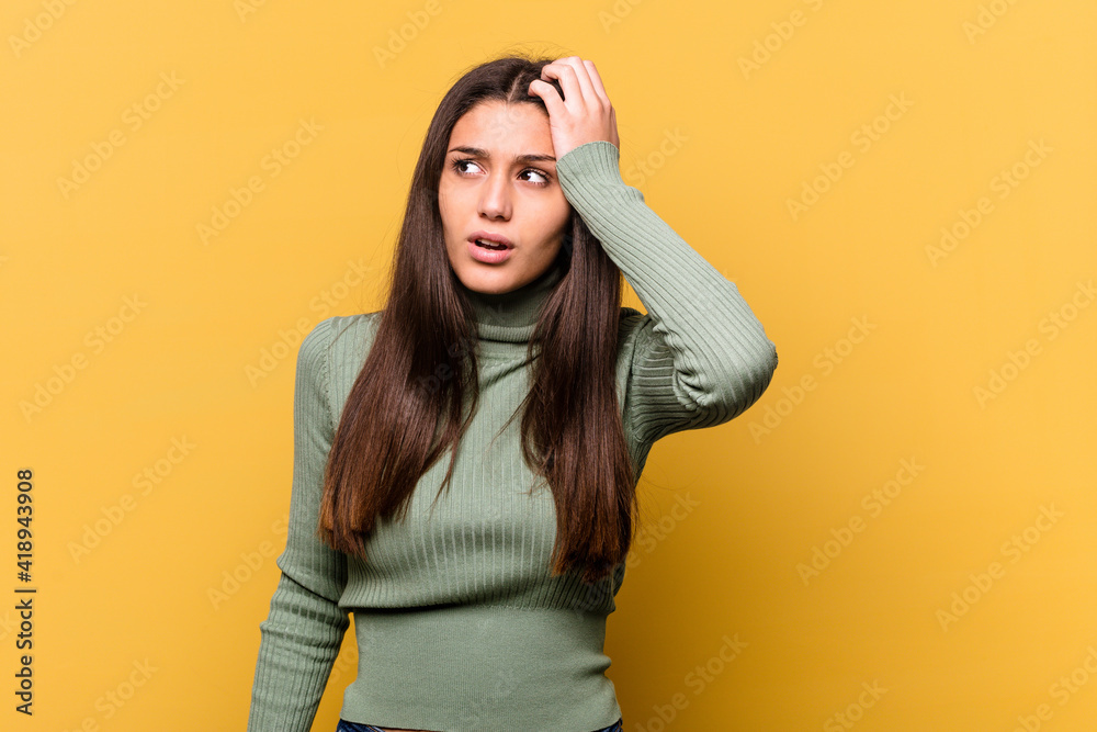 Young Indian woman isolated on yellow background being shocked, she has remembered important meeting. Young Indian woman isolated on yellow background being shocked, she has remembered important meeting.