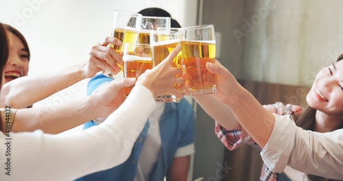 Canvas Print friendship toast beer in restaurant
