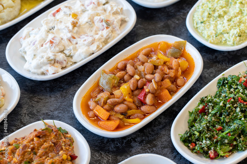 Kidney bean appetizer. Traditional Turkish and Arabic cuisine meze. Snack meal served alongside the main course. Natural vegetarian food. Barbunya plaki. Chili beans