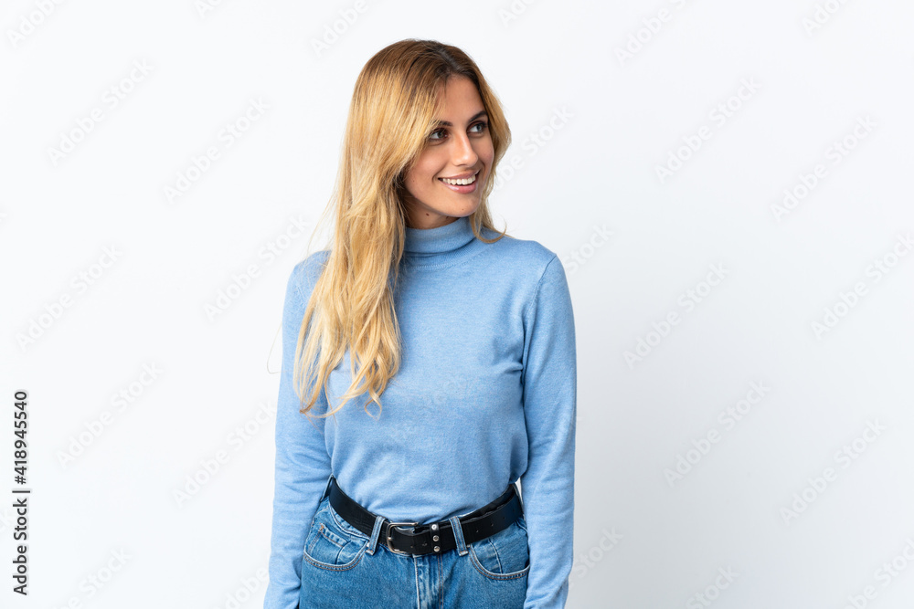 Obraz premium Young blonde Uruguayan woman over isolated background looking side