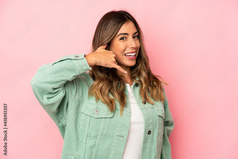 Young caucasian woman isolated showing a mobile phone call gesture with fingers.