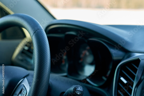 Car. Dashboard and steering wheel close-up. Selective focus