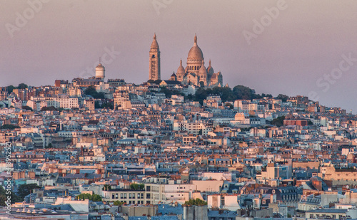 Aerial view of Paris cityscape with Basilica of the Sacred Heart of Paris (Basilique du Sacre Coeur) on Montmartre hill from the top of Triumphal Arch of the Star 