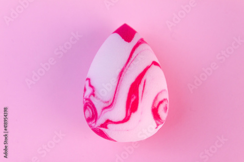 Make-up sponge on pink background