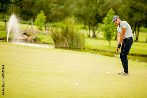 Young man playing golf