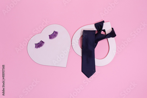 two hearts, love is ... the concept of lovers, she and he.Eyelashes and a tie