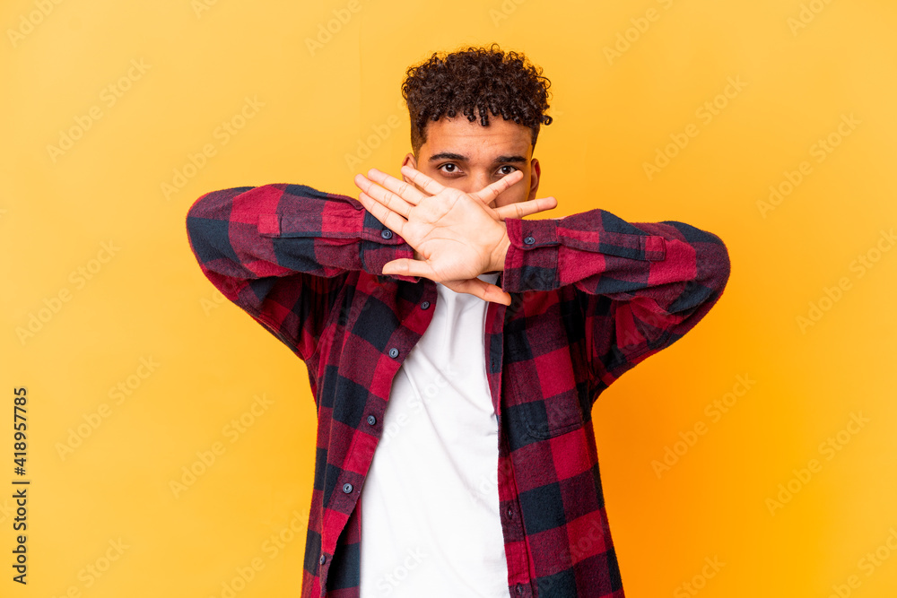 Young african american curly man isolated on purple doing a denial gesture Young african american curly man isolated on purple doing a denial gesture