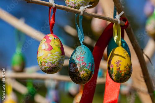 Easter eggs hanging on a branch