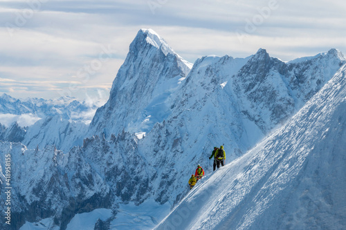 Four mountaineers making a decent in the French Alps near Mont Blanc