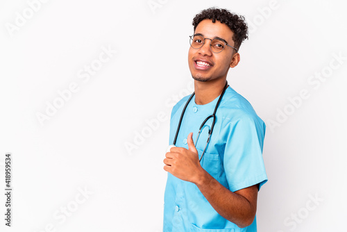 Young african american curly nurse man isolated smiling and raising thumb up