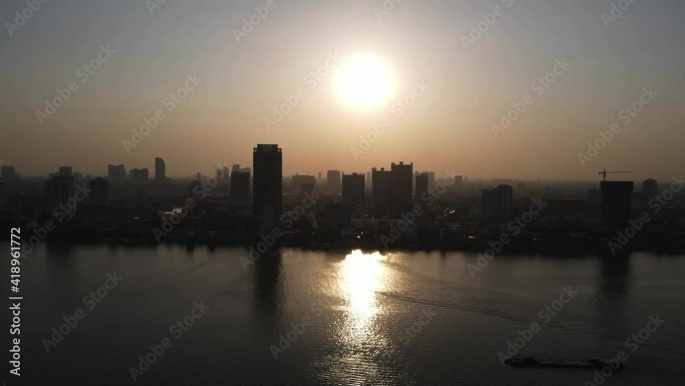 Slow drone overview above the Mekong river at sunset time over Phnom Penh city, Cambodia 2-3 Slow drone overview above the Mekong river at sunset time over Phnom Penh city, Cambodia 2-3