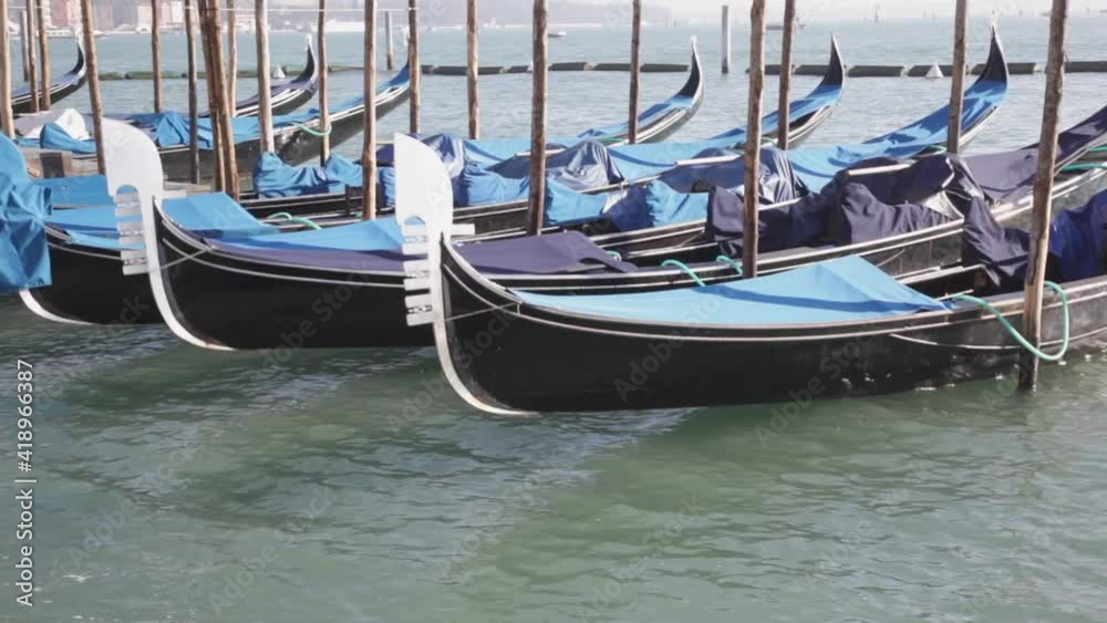 Traditional Gondolas Boats Moored in Venice Italy Traditional Gondolas Boats Moored in Venice Italy