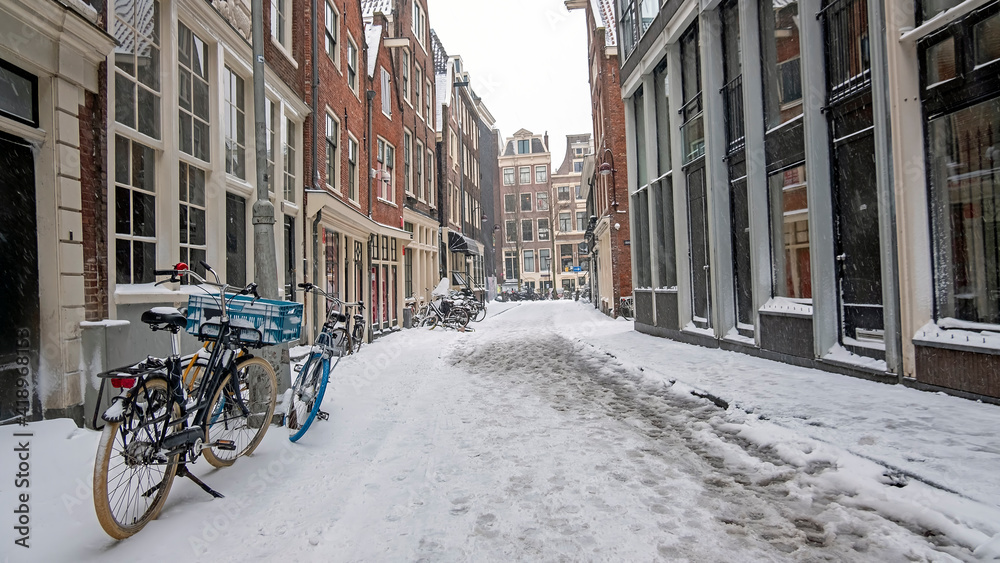 Snowy city Amsterdam in the Netherlands in winter