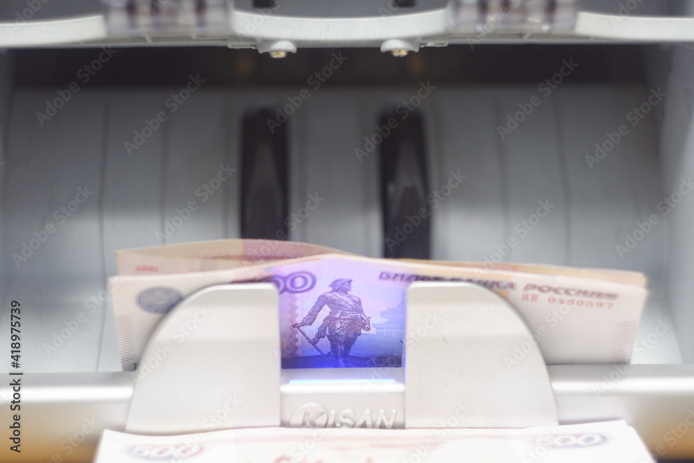 Fototapeta premium Automatic money counting machine.Russian banknotes on the counting machine.