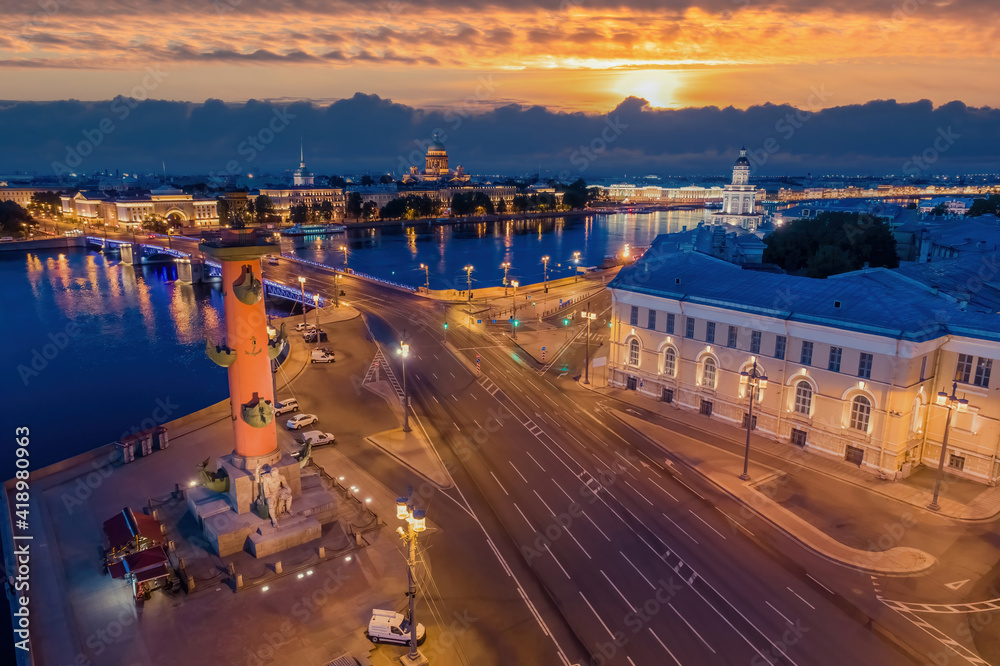 Evening Saint-Petersburg. Cities of Russia. Beautiful sunset over Petersburg. Aerial view of the Vasilievsky island and the Neva river. Rivers Of Petersburg. Admiralty and St. Isaac Cathedral.