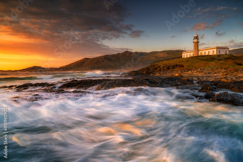 Lariño or Punta Insua lighthouse at sunset. Carnota, Galicia, Spain
