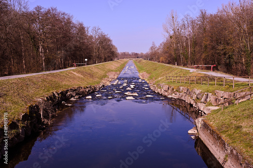 Irrigation water channel in a rural landscape. Upper Rhine Valley, Baden Wuerttemberg, Germany photo