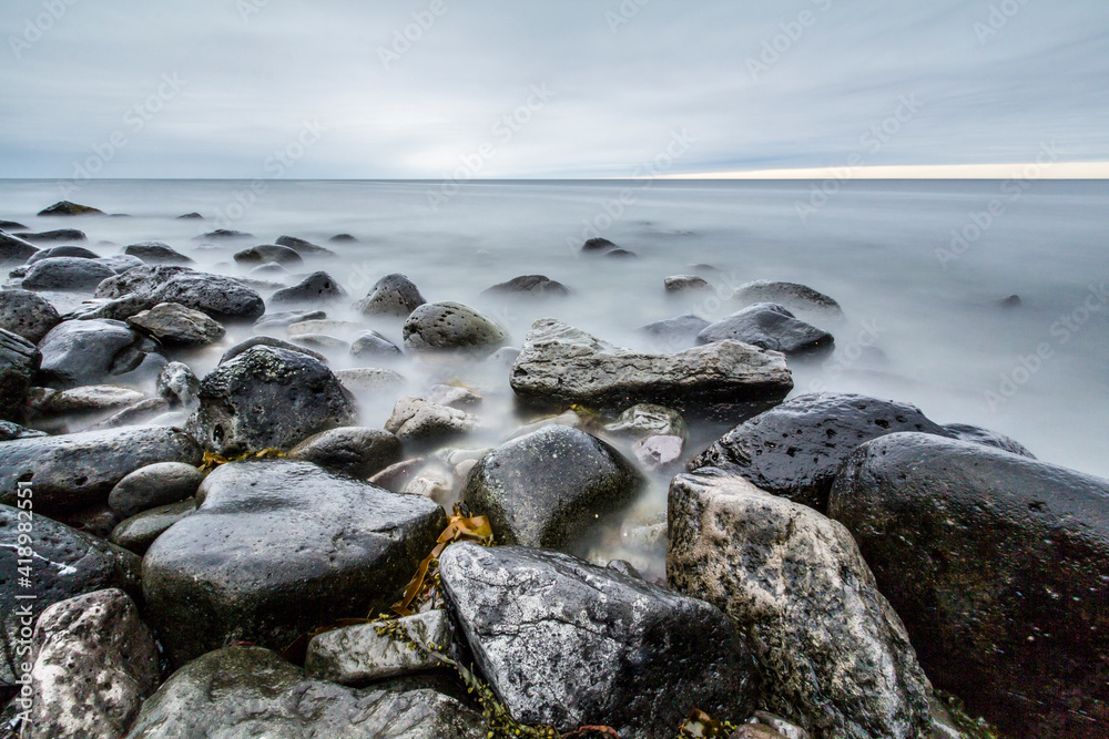 Obraz premium Time exposure of stones at the Westfjords coast