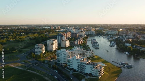 Beautiful Traveling Forward Aerial Shot Over Luxury Apartment Buildings and Bay, In Nordelta, Buenos Aires, Argentina. photo