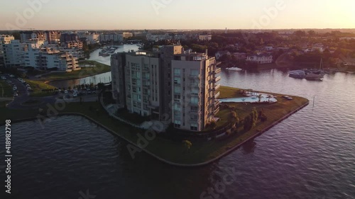 Beautiful Circular Aerial Shot of Luxury Apartment Buildings and Marina, In Nordelta, El Tigre, Argentina. photo