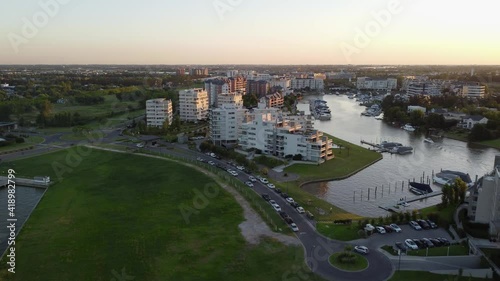 Beautiful Traveling Forward Aerial Shot Over Luxury Apartment Buildings and Bay, In Nordelta, El Tigre, Argentina. photo