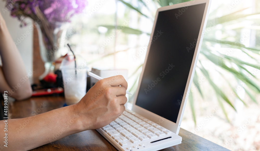 Fototapeta premium Close up of male hand using digital pen writing on digital tablet screen. Concept business meeting and .technology with electronic gadget