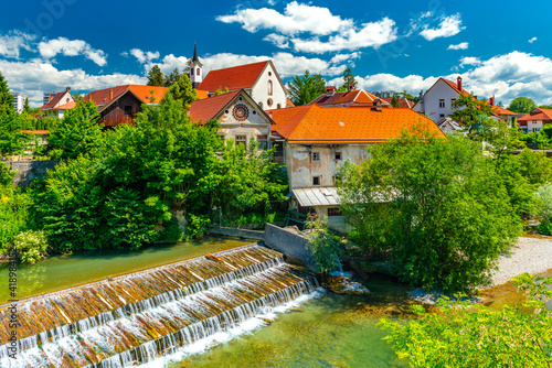 A small waterfall in the ancient Slovenian town Škofja Loka photo
