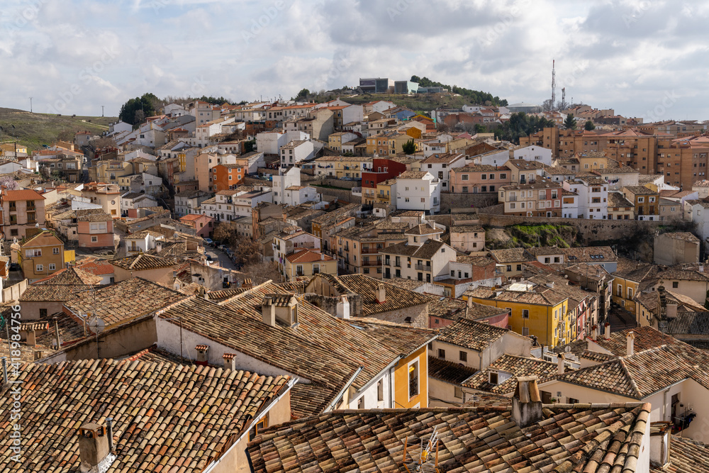 view of the rooftops and colorful houses of the old city center of Cuenca